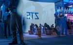 The ZTE Corp. logo projected on a screen is reflected on a pane of glass at the Ericsson AB booth at the Mobile World Congress Shanghai.