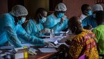 Health workers from the Guinean Ministry of Health prepare forms to register medical staff ahead of their anti-ebola vaccines at the N'zerekore Hospital on Feb. 24, 2021.