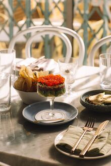 Grey Gardens caviar and a bowl of potato chips.