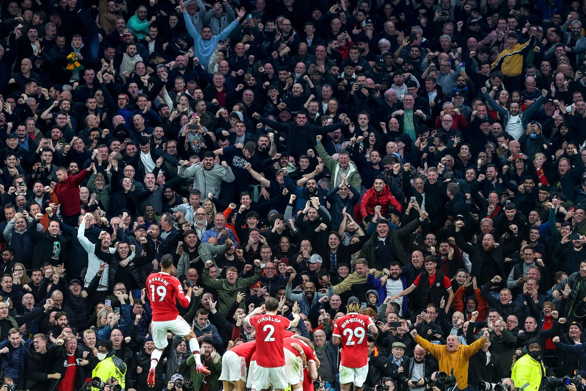 Fans celebrate a Manchester United goal with the team during the Premier League match between Tottenham Hotspur and Manchester United at Tottenham Hotspur Stadium in London, on Oct. 30.