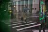 A pedestrian carries and umbrella while walking in New York, U.S., on Wednesday, Feb. 26, 2020. U.S. equities swung between gains and losses as investors digested fresh evidence of the widening coronavirus outbreak.