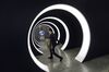An attendee walks through the entrance of Tencent Holdings Ltd.'s WeChat Open Class Pro conference in Guangzhou, China.
