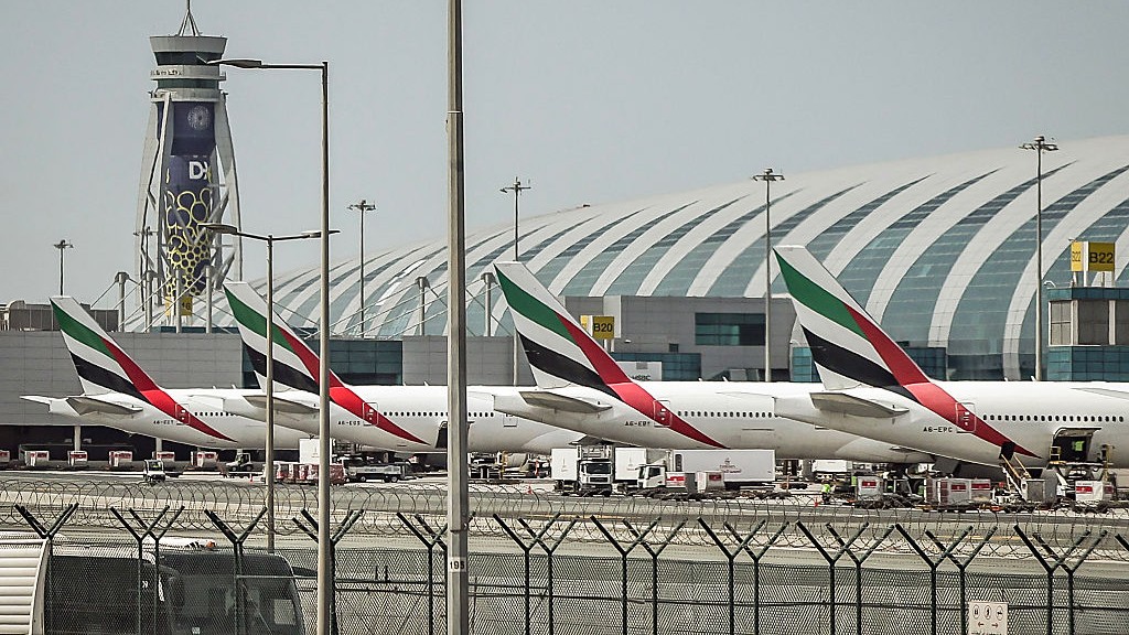 Dubai International Airport briefly halted operations on Wednesday after drones smashed down at the facility, resulting in four injuries at the world's busiest international hub. The widening war with Iran continues to disrupt travel with more than 46,000 flight cancellations across the region since the conflict began on Feb. 28. Bloomberg's Leen Al-Rashdan reports.