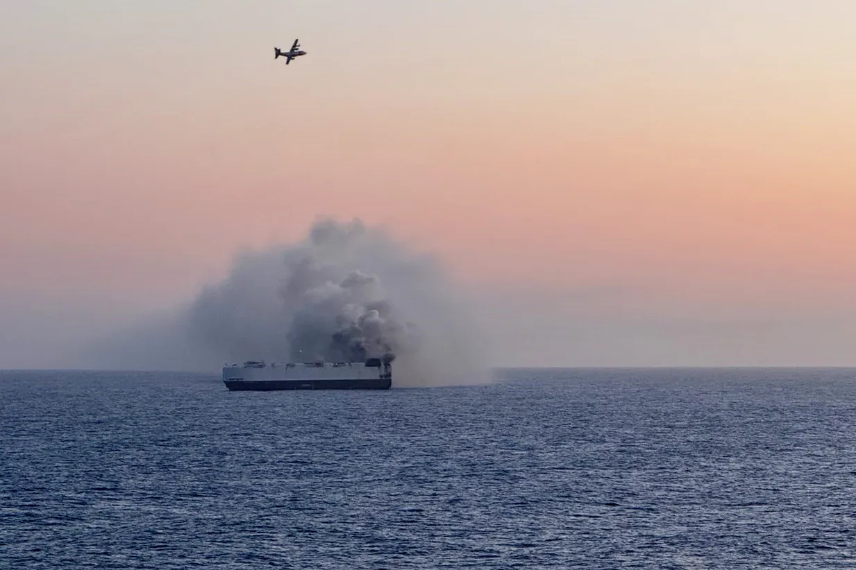 Smoke rises from the Morning Midas cargo ship in the Pacific Ocean, on June 3.