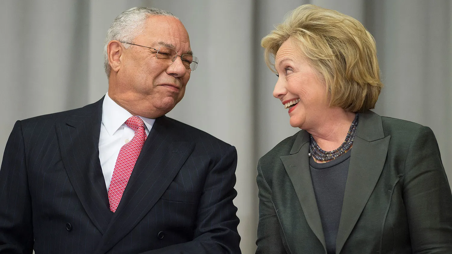 Former Secretaries of State Colin Powell and Hillary Clinton speak in Washington on Sept. 3, 2014.

