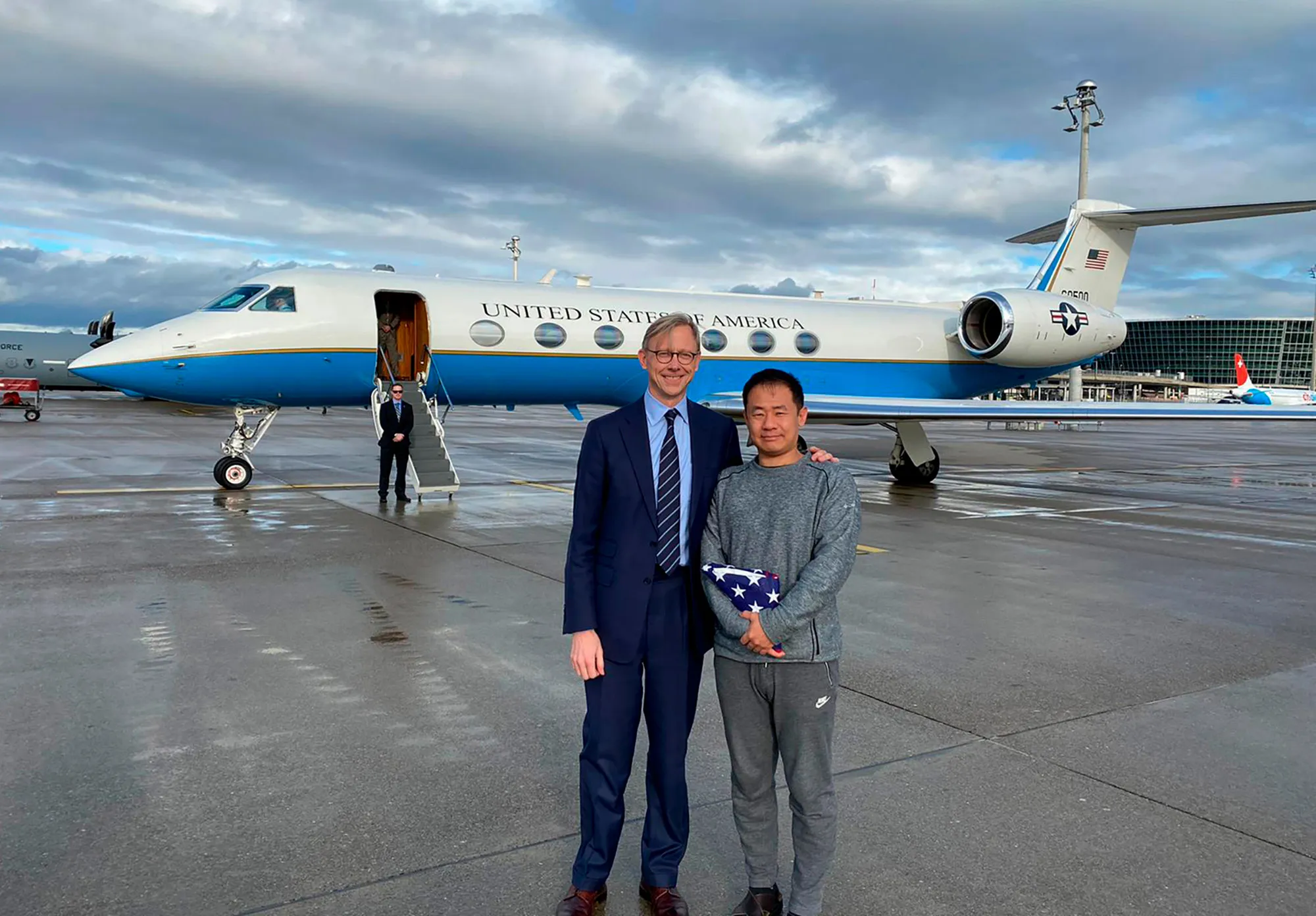 U.S. special representative for Iran, Brian Hook stands with Xiyue Wang in Zurich, Switzerland on&nbsp;Dec. 7.