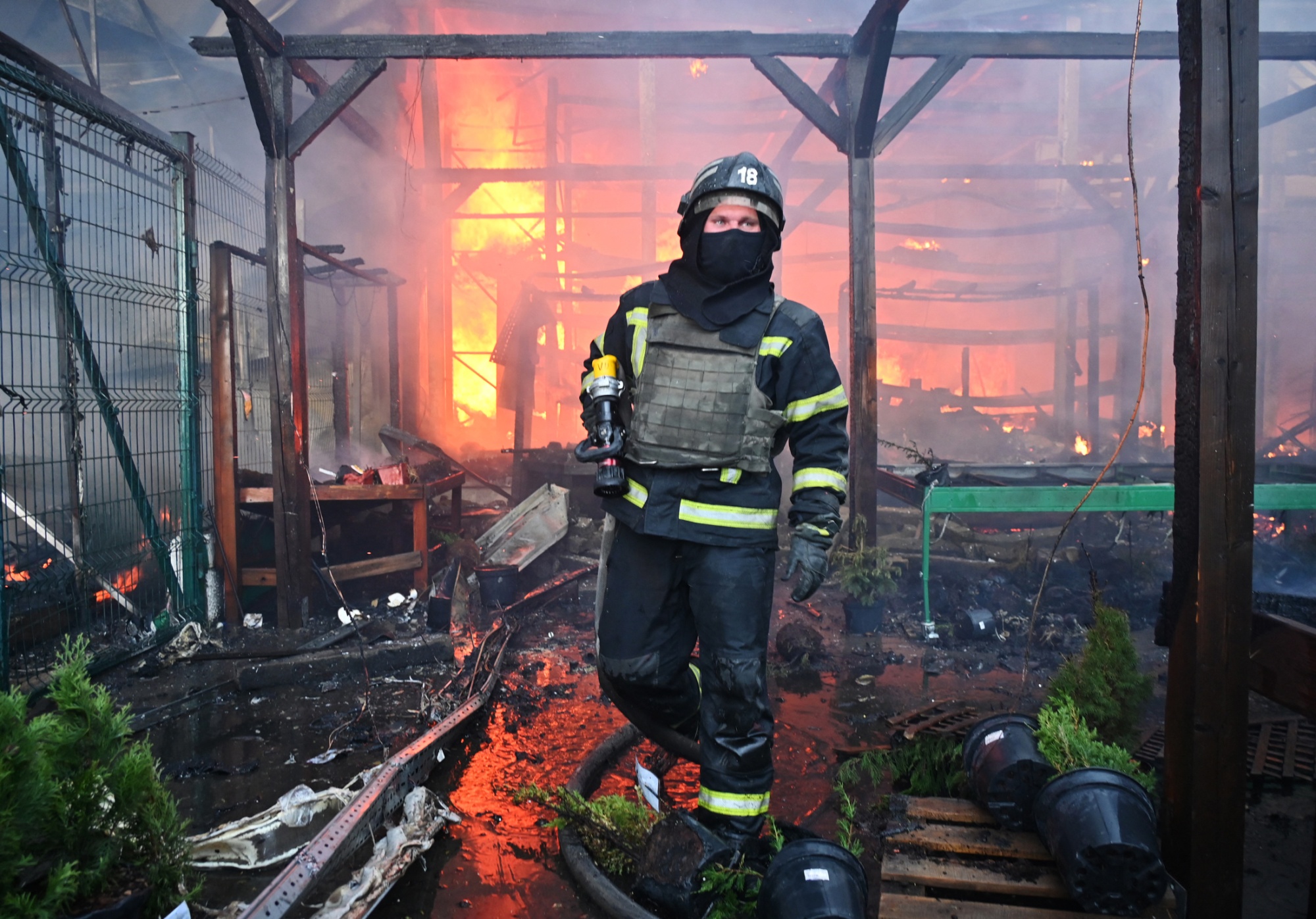 A firefighter tackles a blaze following a Russian strike in Kharkiv, Ukraine, on May 25.