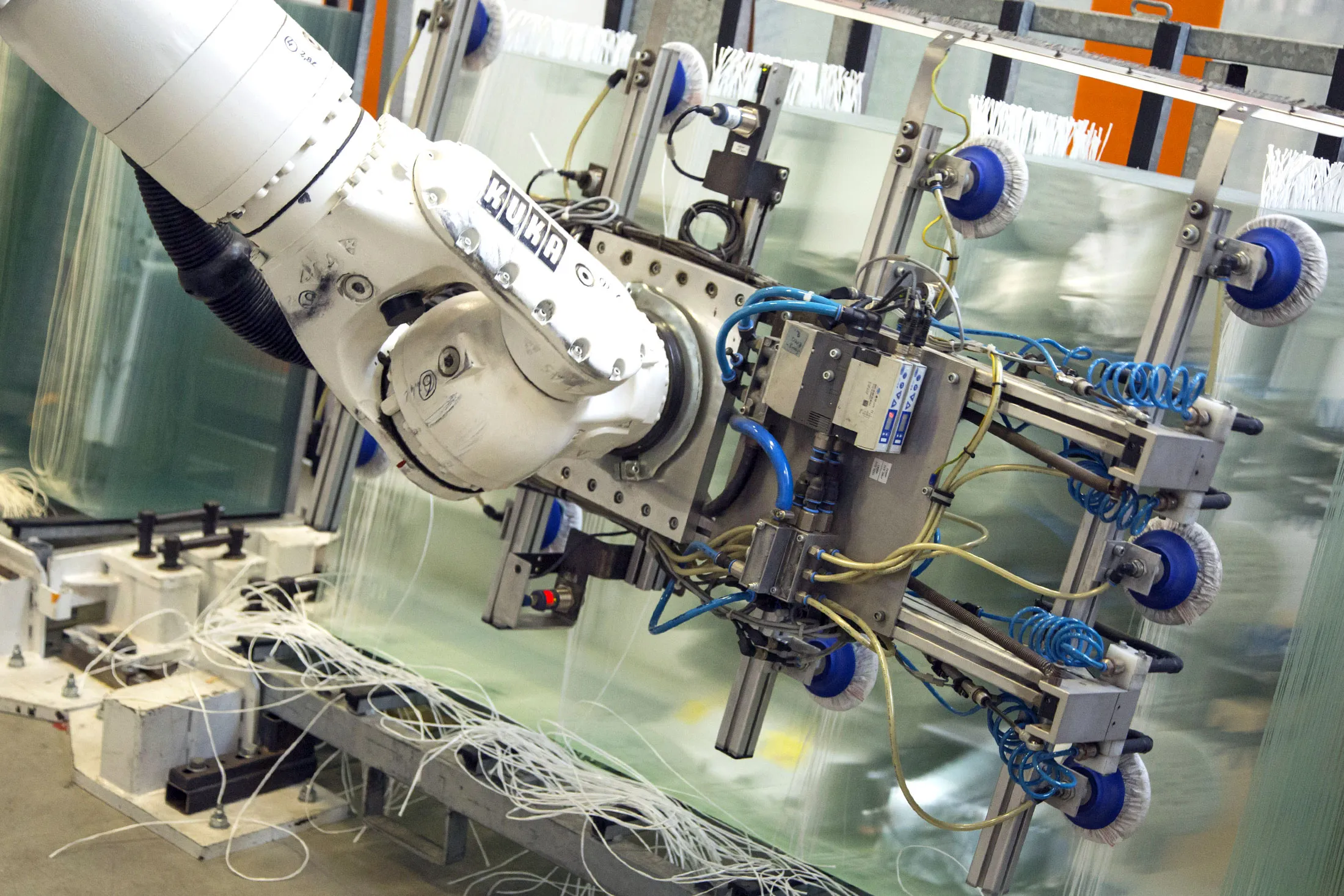 A robotic arm, manufactured by Kuka AG, transports sheets of glass during photovoltaic cell manufacture at Solarworld AG in Freiberg, Germany, on Thursday, July 29, 2016. Solarworld rose the most in five months after the German solar panel maker resolved to fight a U.S. court ruling that awarded damages to the U.S. polysilicon supplier Hemlock Semiconductor Corp.
