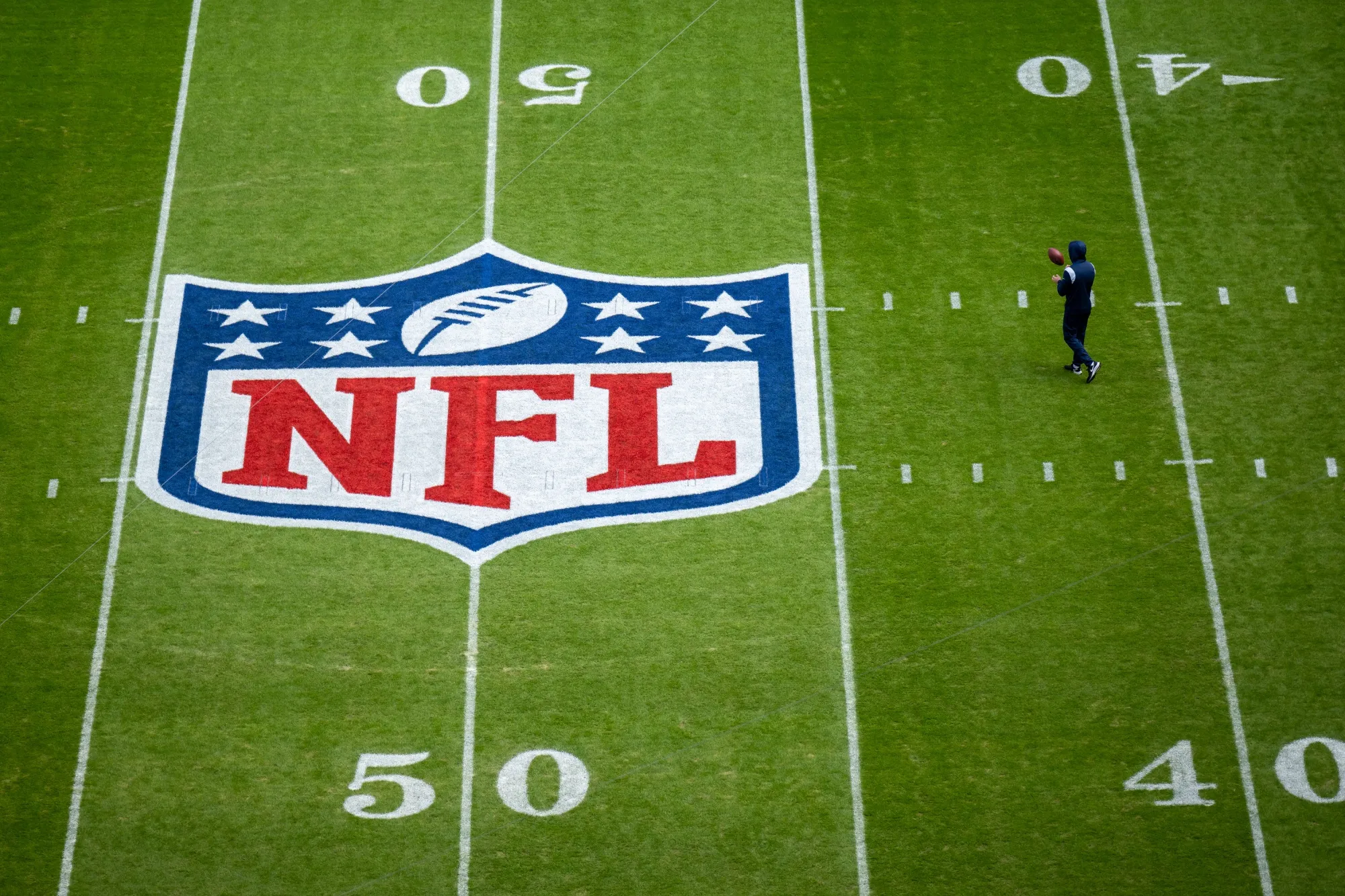 The NFL logo painted on a field.