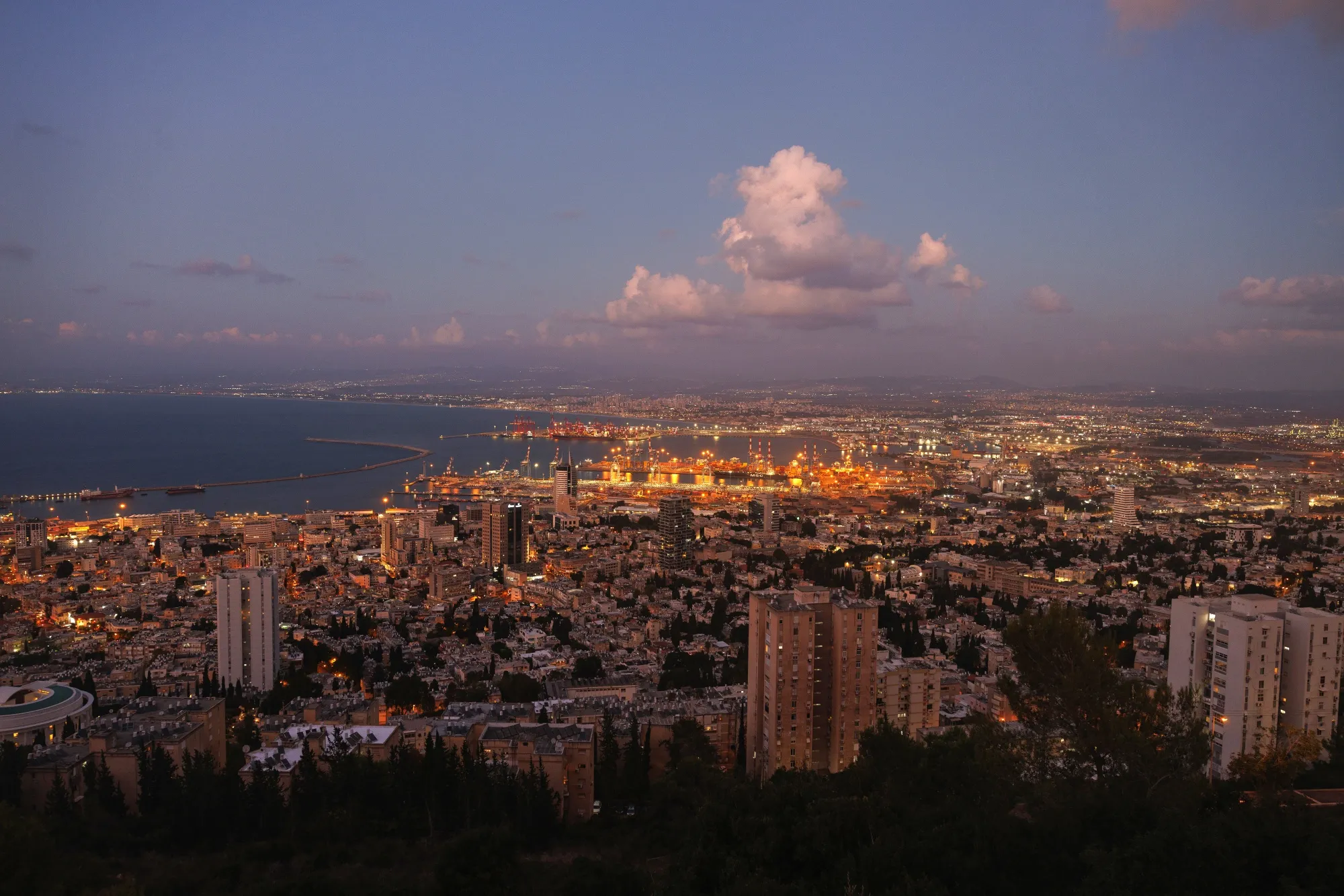 The dockyards at Haifa Port beyond city buildings in Haifa, northern Israel.