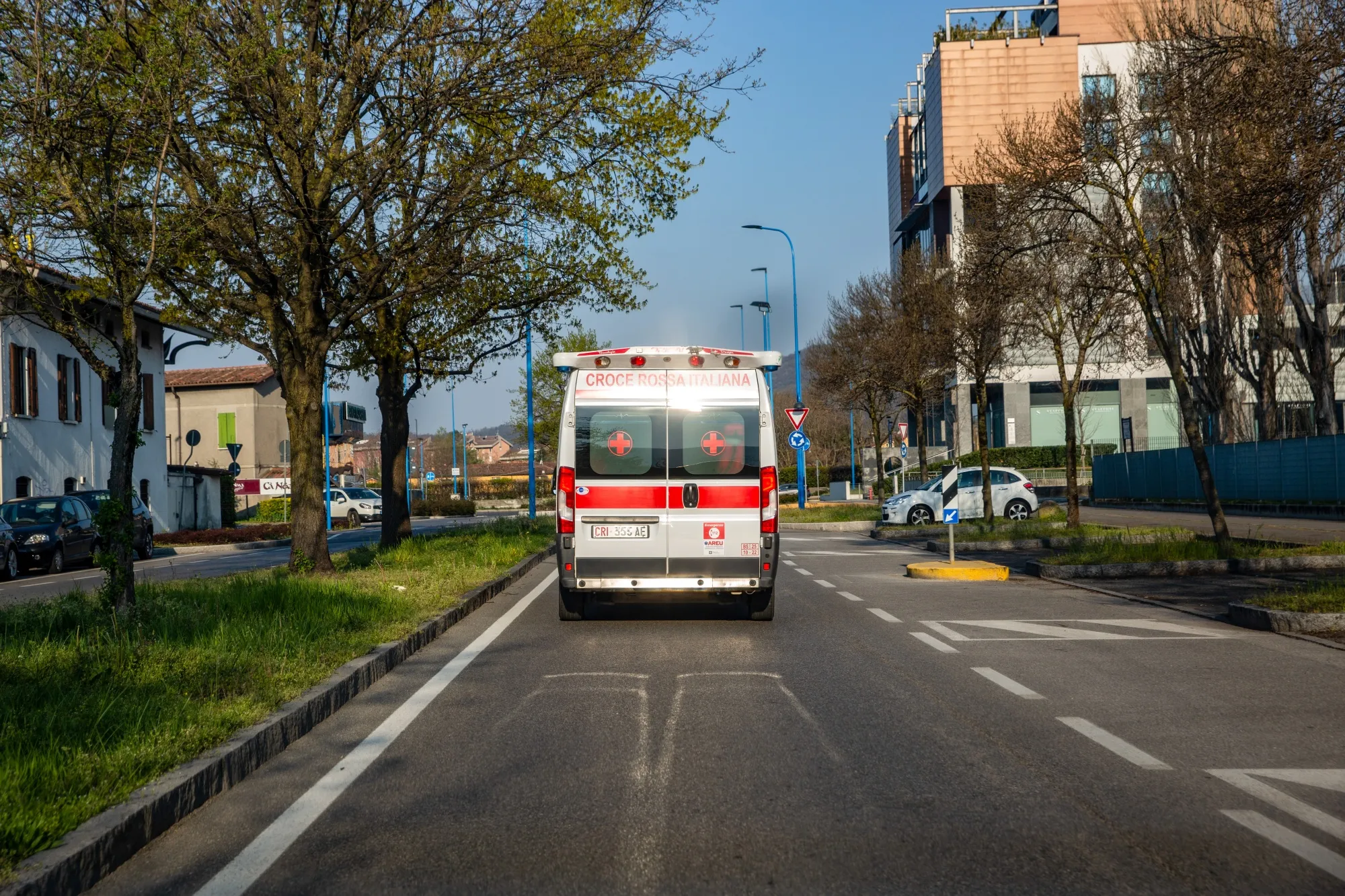 An ambulance of the Red Cross drives along a street in Brescia, Italy, on April 3.