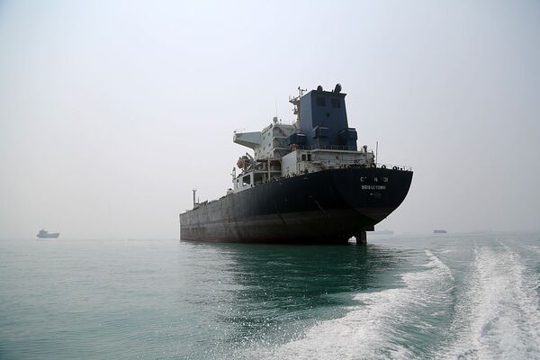 Commercial vessels remain anchored off Bandar Abbas following Iran's closure of Strait of Hormuz