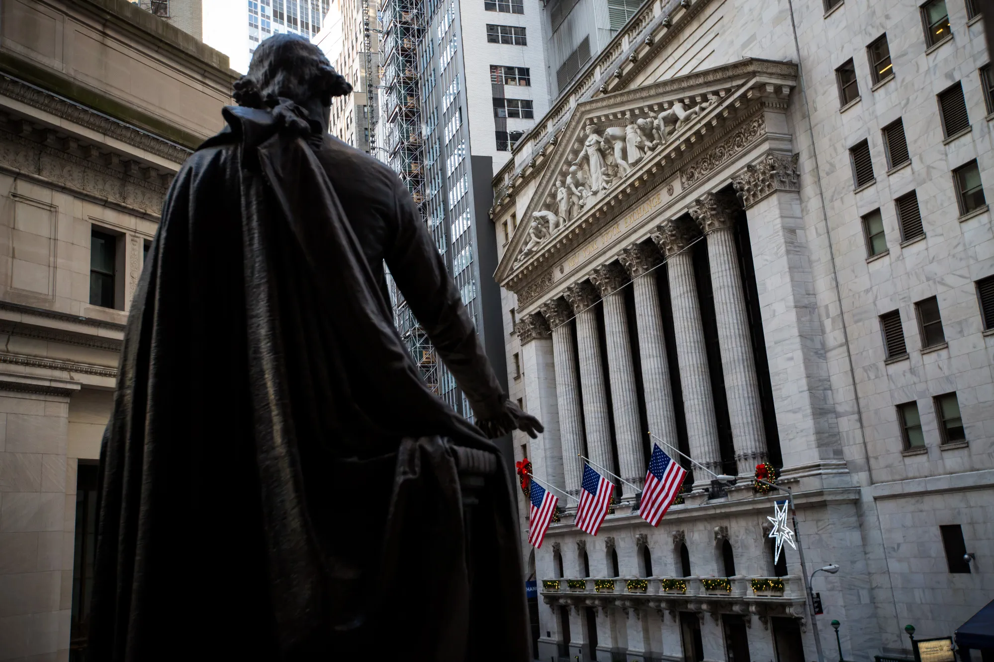 A statue of George Washington stands across from the New York Stock Exchange (NYSE) in New York, U.S., on Friday, Dec. 29, 2017.