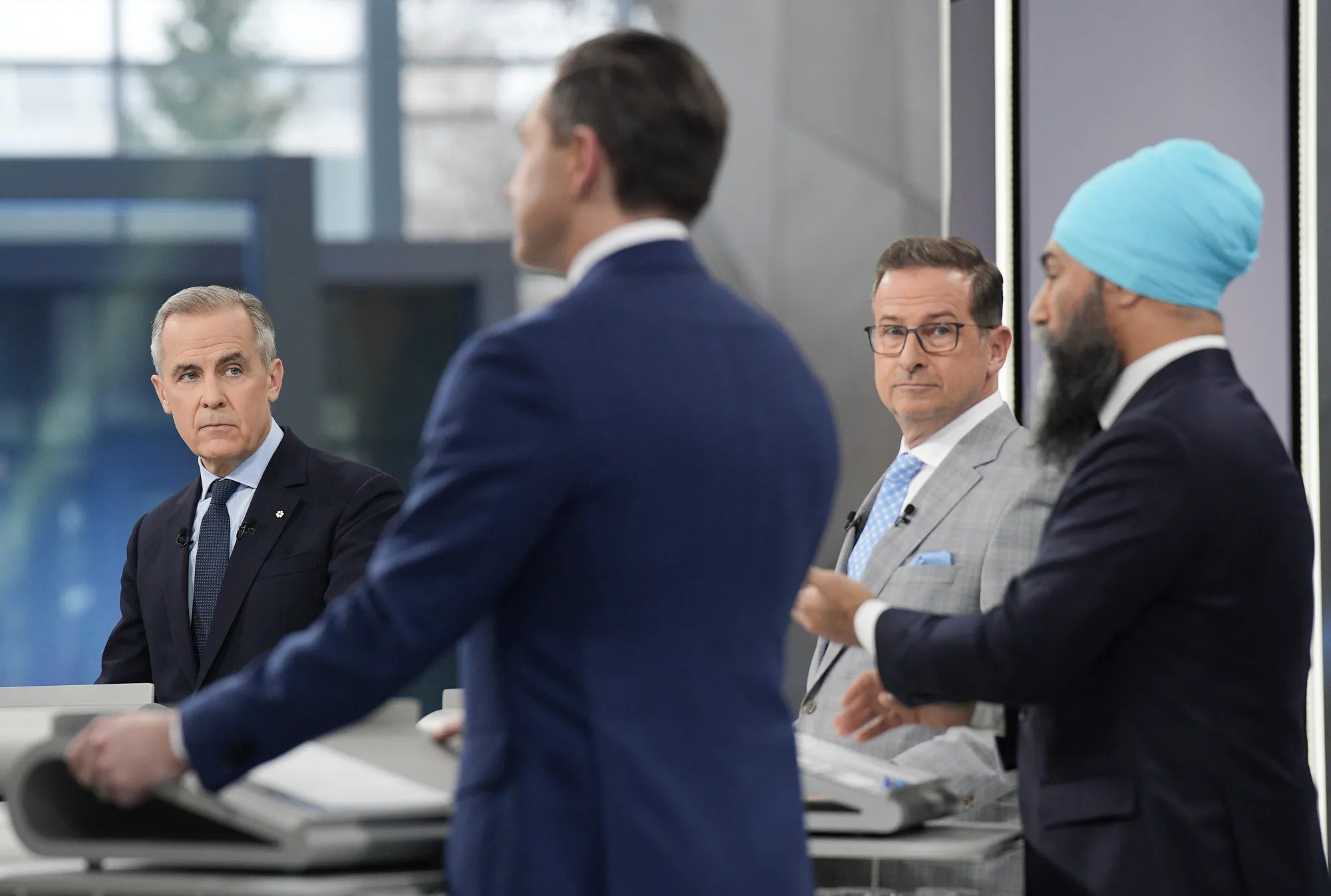 Mark Carney, Pierre Poilievre, Yves-Francois Blanchet and&nbsp;Jagmeet Singh participate in an election debate.