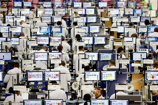 Employees assemble Motorola Moto X smartphones at the Flextronics International factory in Fort Worth, Texas