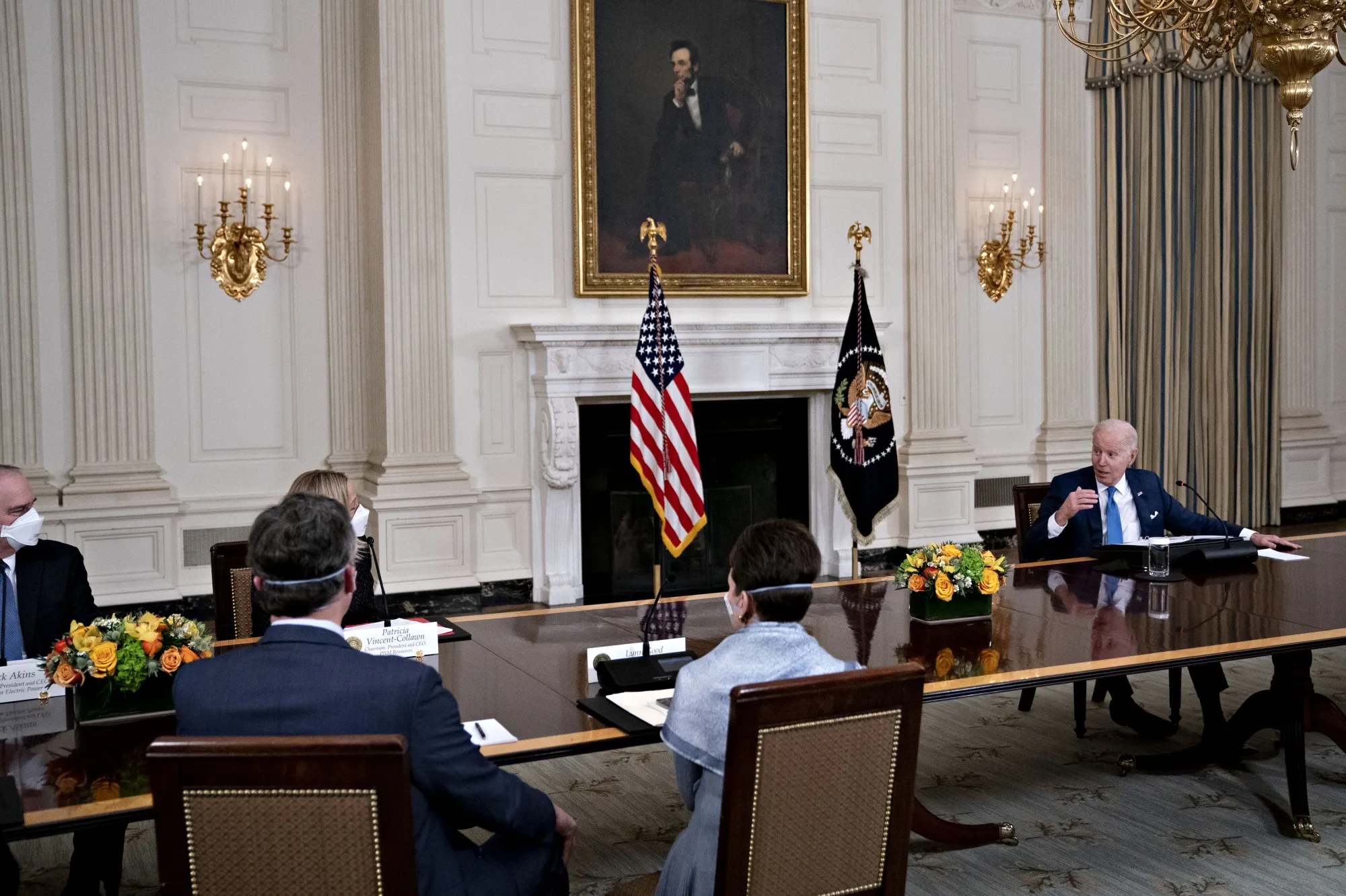 U.S. President Joe Biden, right, speaks while meeting with chief executive officers of electric utilities in the State Dining Room of the White House on Feb. 9, 2022.