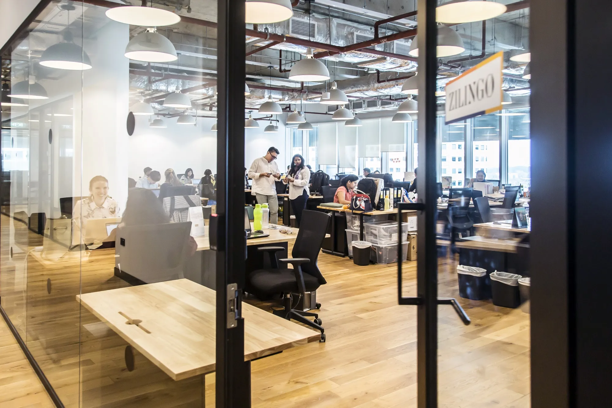 Employees work at the Zilingo office in Singapore.