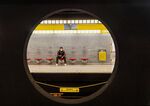 A commuter wearing a protective face mask waits for a subway train in Milan, Italy.