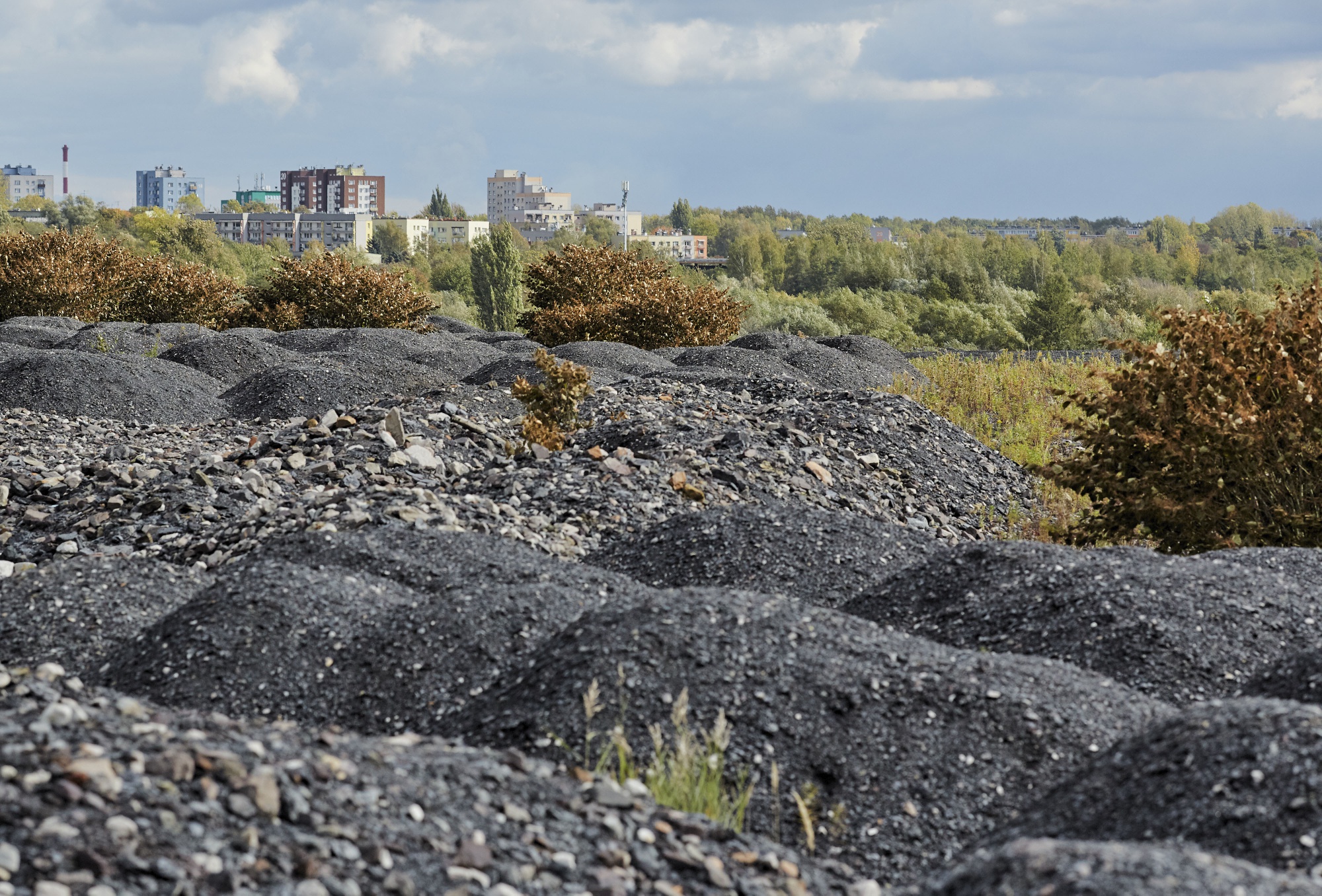 Discarded coal sits heaped outside the Murcki mine near residential property in the Silesia regional city of Katowice, Poland.