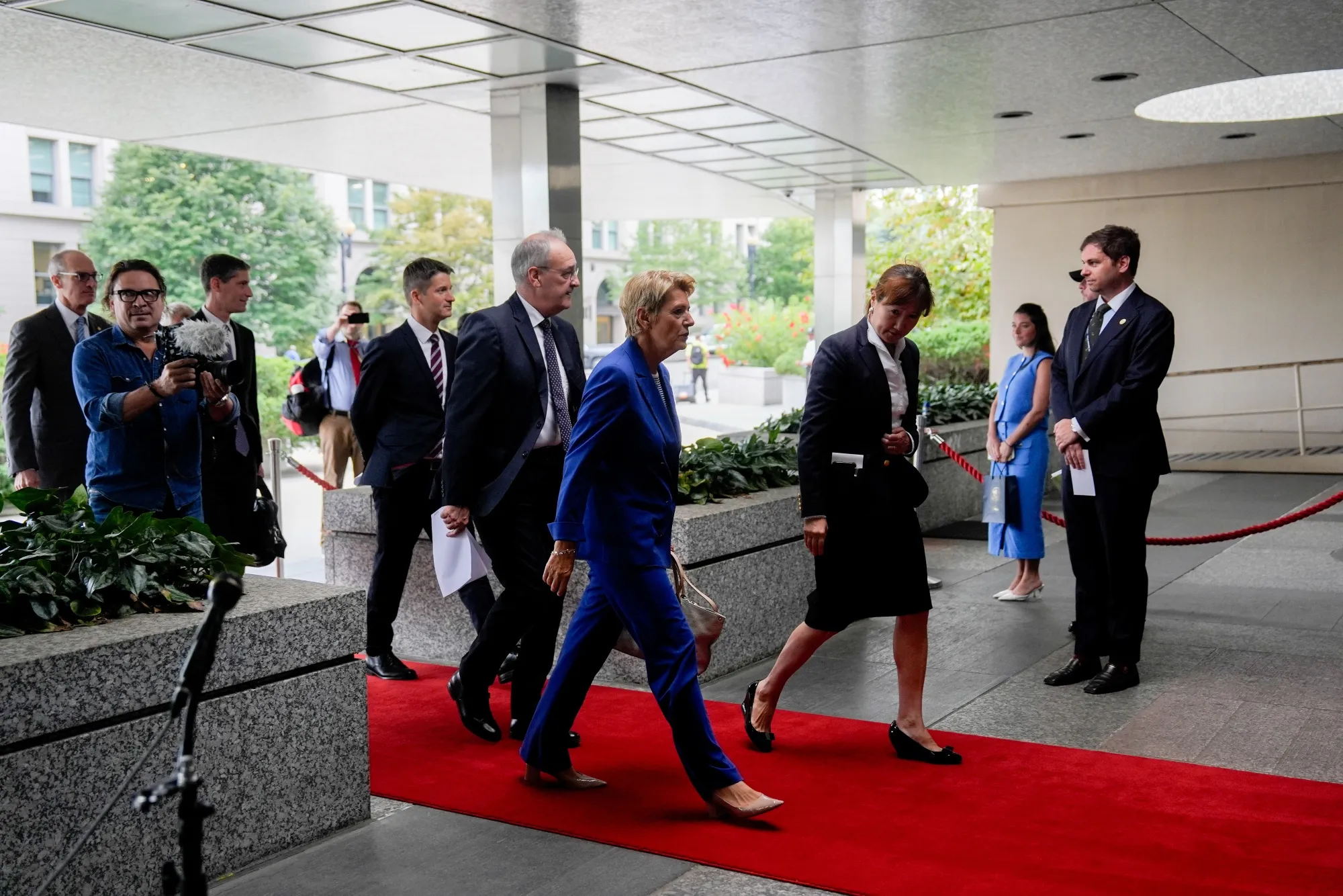 Karin Keller-Sutter, Switzerland’s president, center, and Guy Parmelin, Switzerland’s economy minister, center left, arrive at the US State Department in Washington on Aug. 6.
