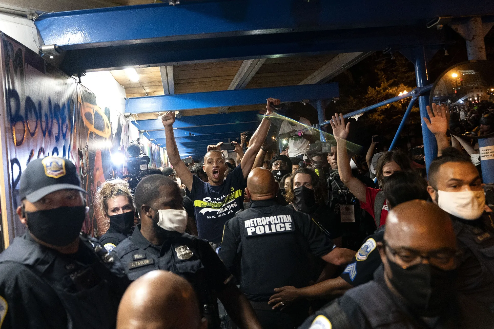 A protester yells next to police officers during the Republican National Convention in Washington, D.C., U.S., on&nbsp;Aug. 27.