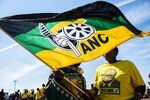 Supporters wearing&nbsp;African National Congress party colors wave a flag&nbsp;in Bloemfontein, South Africa.