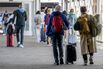 Travelers At SFO Airport Ahead Of Independence Day Holiday