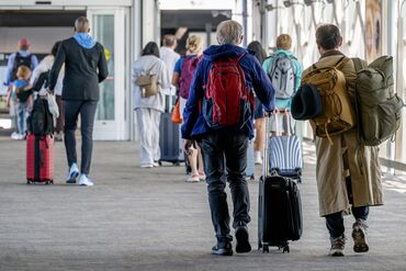 Travelers At SFO Airport Ahead Of Independence Day Holiday