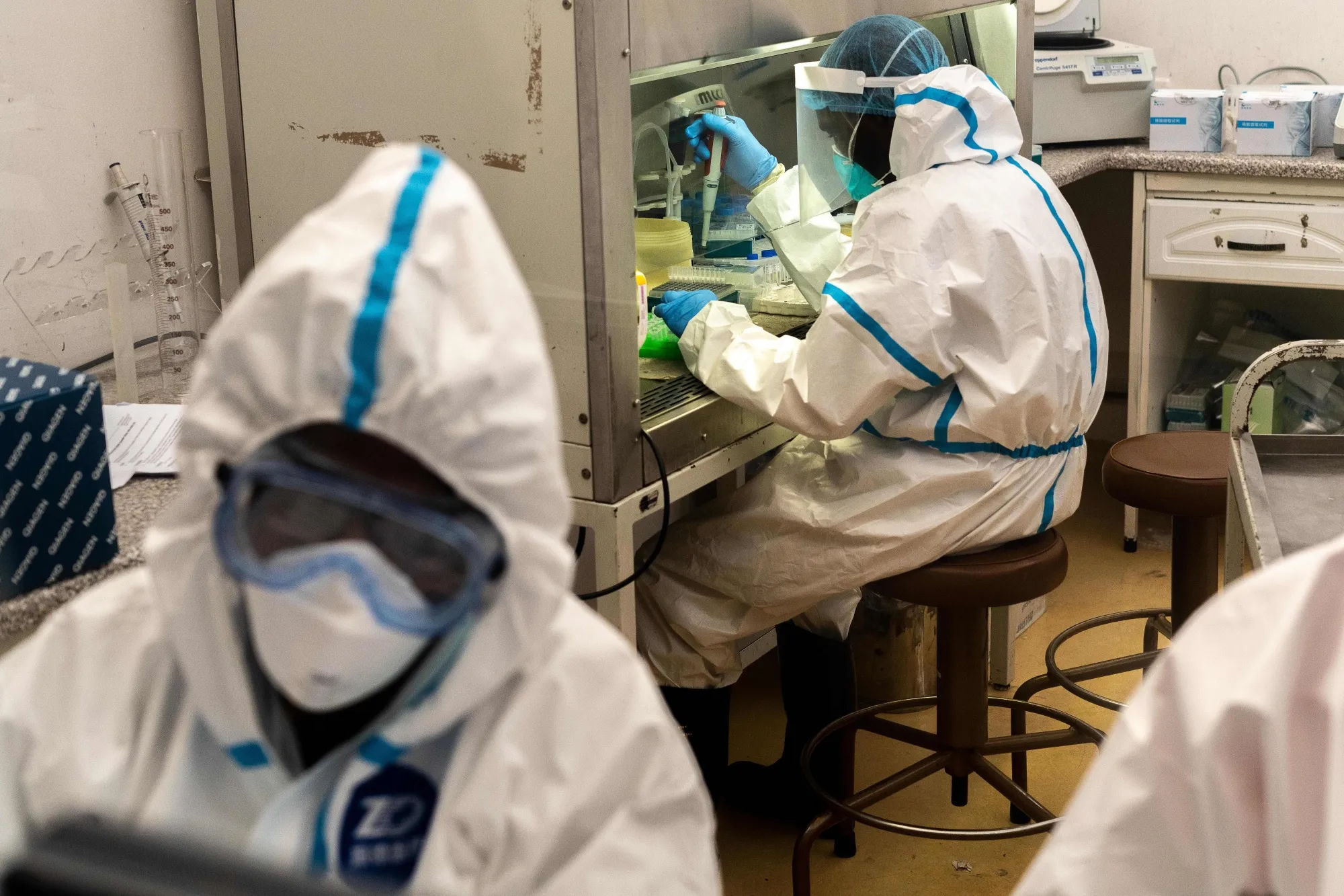 Members of National University of Science and Technology (NUST) work on specimens in a COVID-19 laboratory testing centre at Mpilo Hospital in Bulawayo, Zimbabwe.