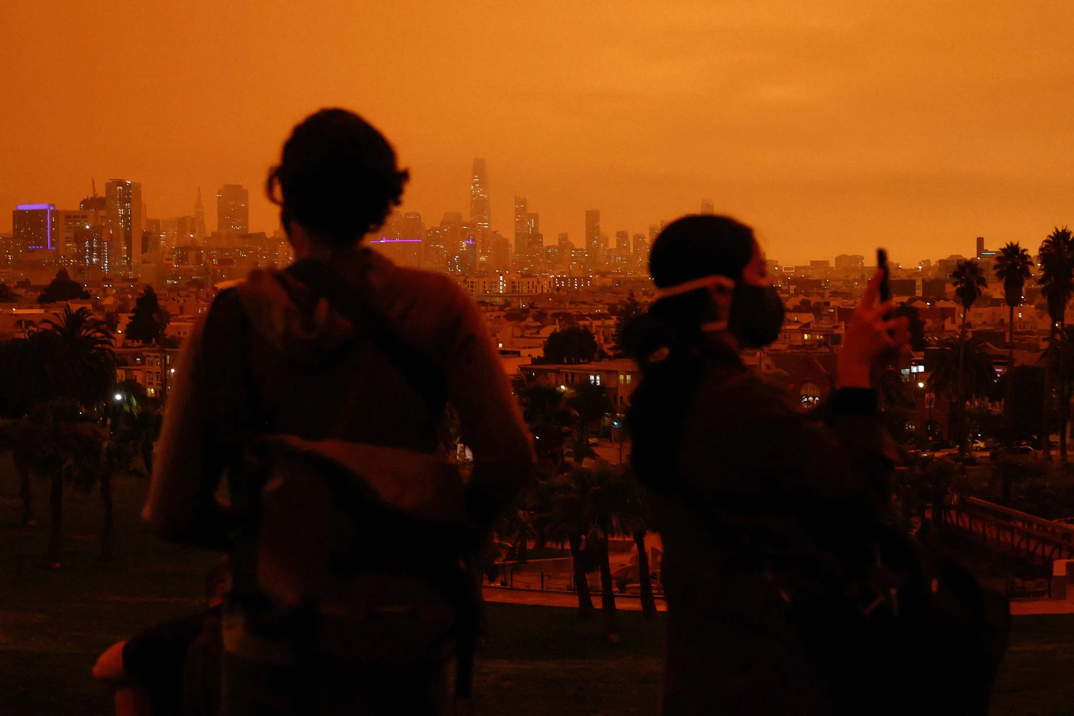 San Francisco’s Dolores Park under an orange sky darkened by smoke from California wildfires.