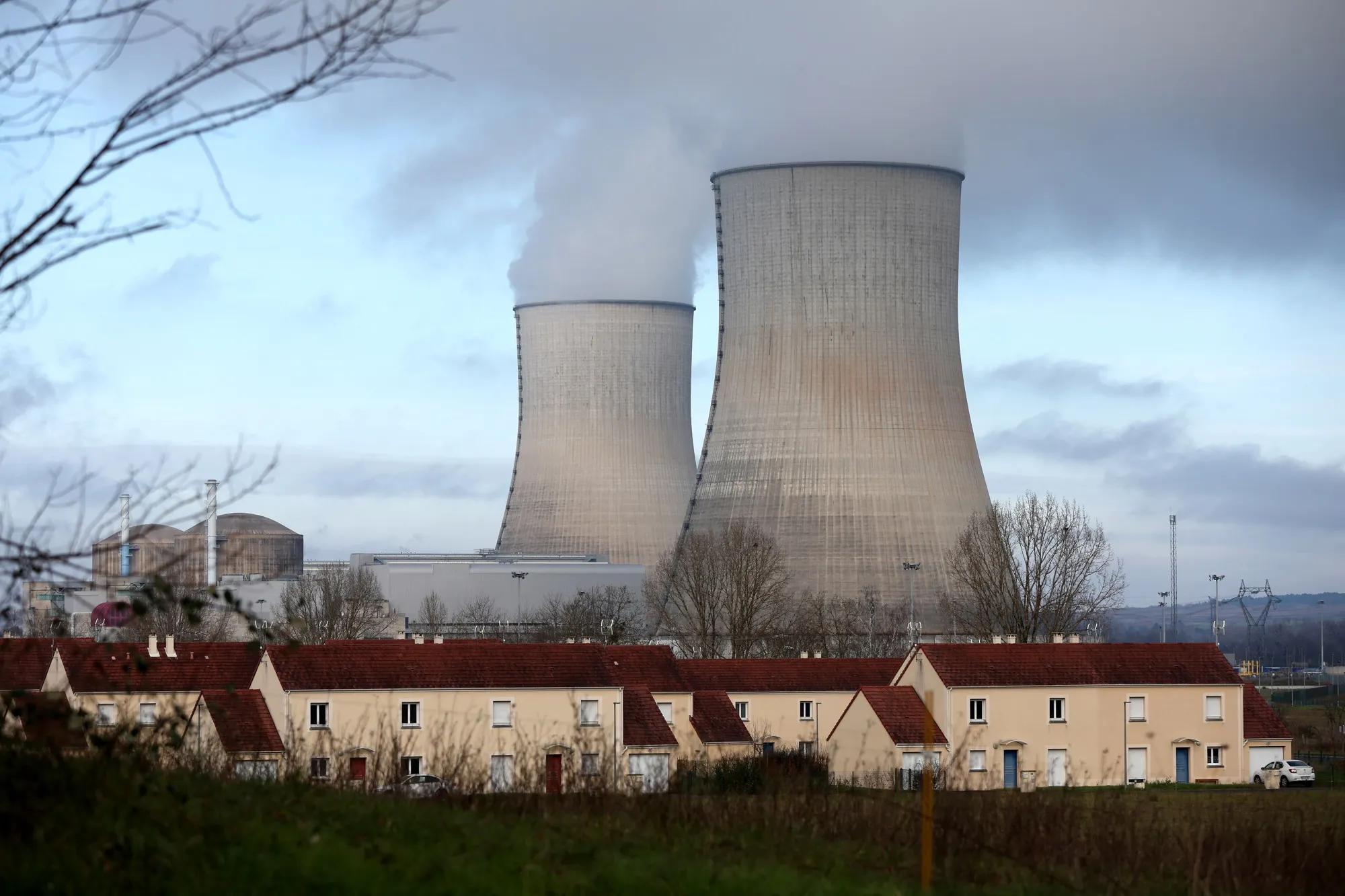 Cooling towers at the Civaux nuclear power plant near a residential area in Civaux, France.