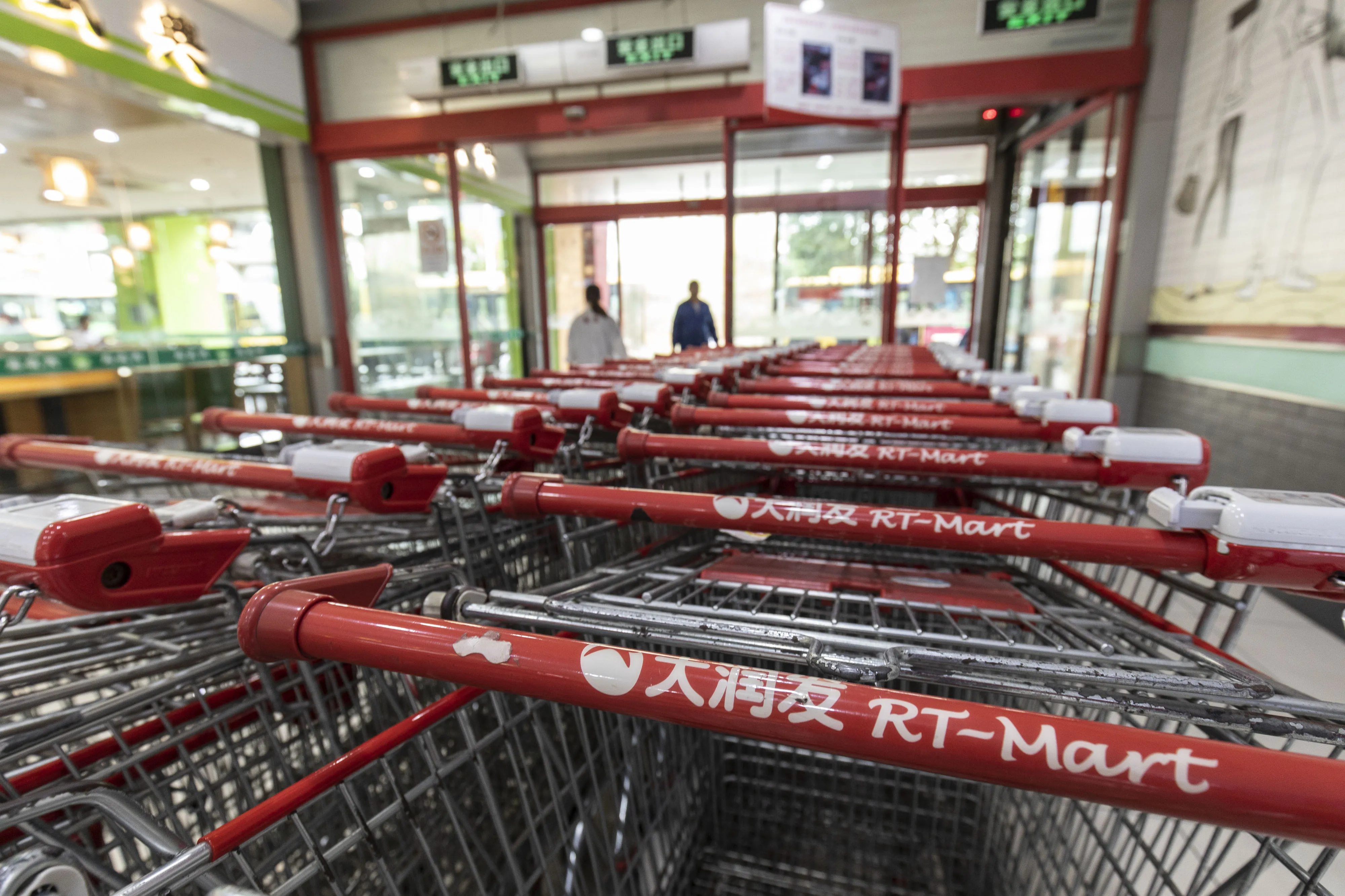 Shopping carts outside an RT-Mart hypermarket, operated by Sun Art Retail Group Ltd., in Shanghai.
