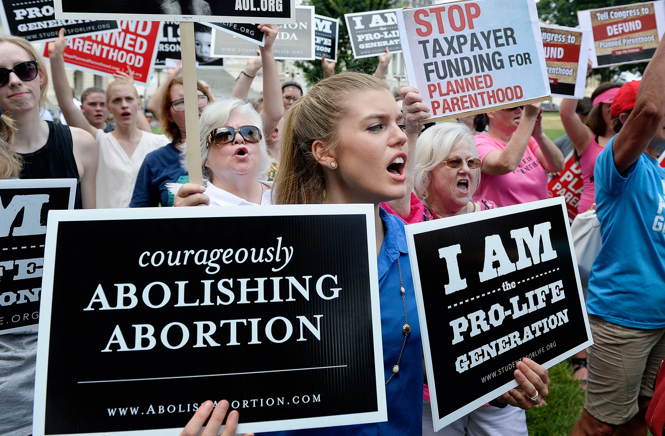 Anti-abortion activists hold a rally opposing federal funding for Planned Parenthood in front of the U.S. Capitol in Washington on July 28.

