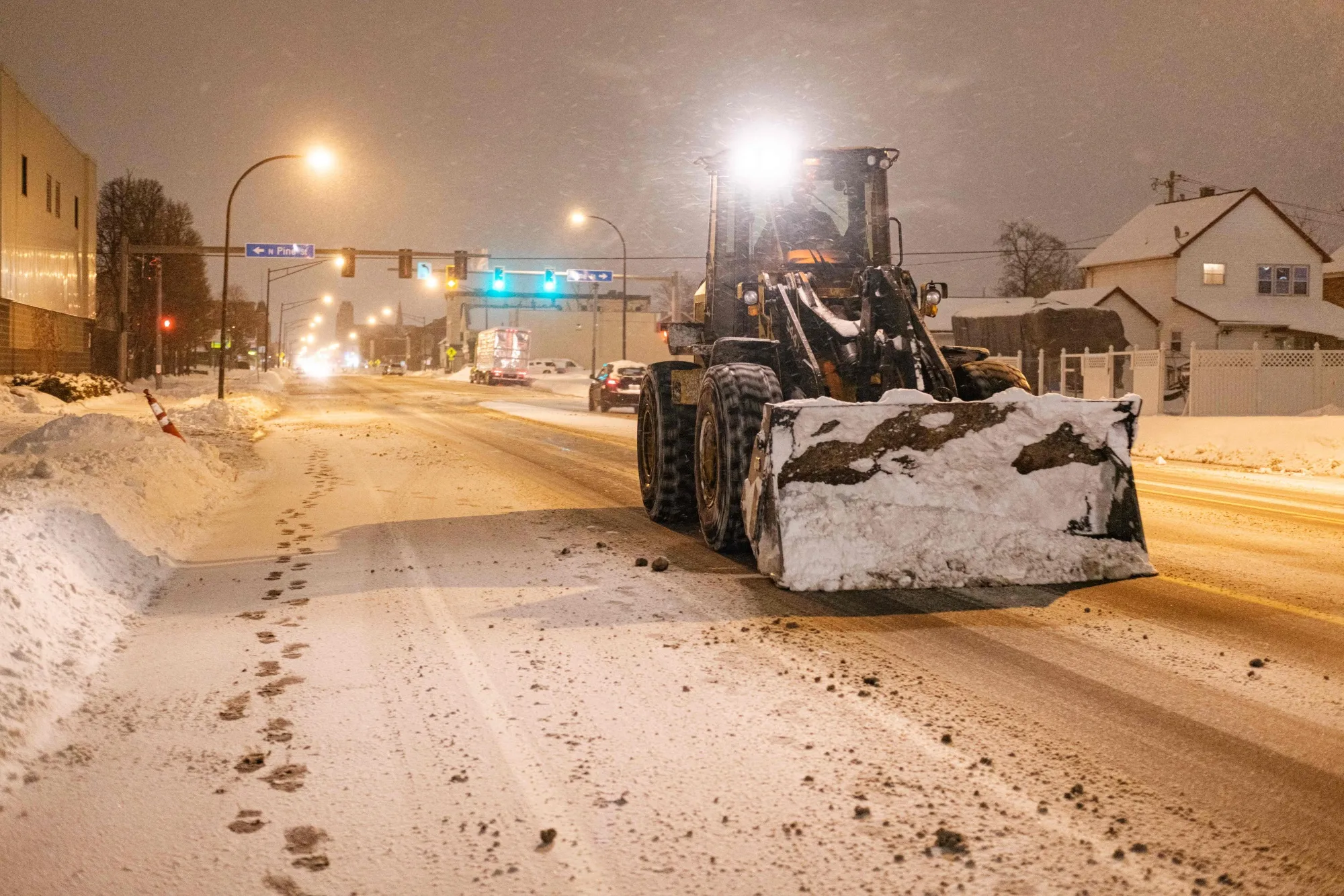 An excavator drives through Buffalo, New York, on December 27.&nbsp;