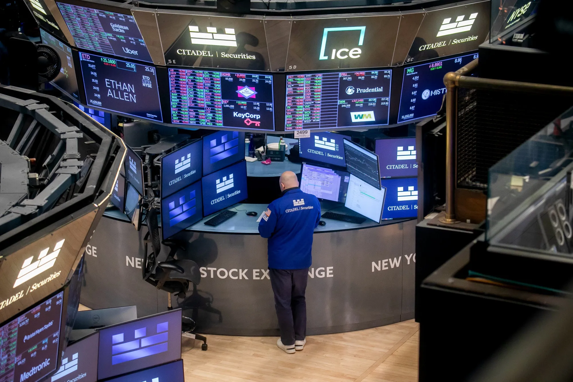 A trader works on the floor of the New York Stock Exchange in New York.