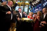 Rob Roy, founder and chief executive officer of Switch Inc., center left, rings a ceremonial bell during the company's initial public offering (IPO) on the floor of the New York Stock Exchange on Oct. 6, 2017.