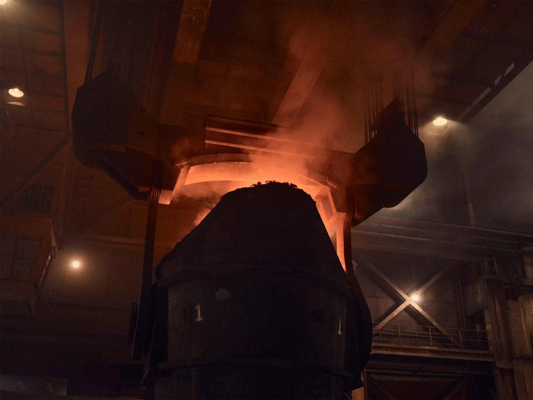 A smoking vat is removed after the molten steel has been poured out at U.S. Steel’s Edgar Thomson plant in Braddock, Pa.