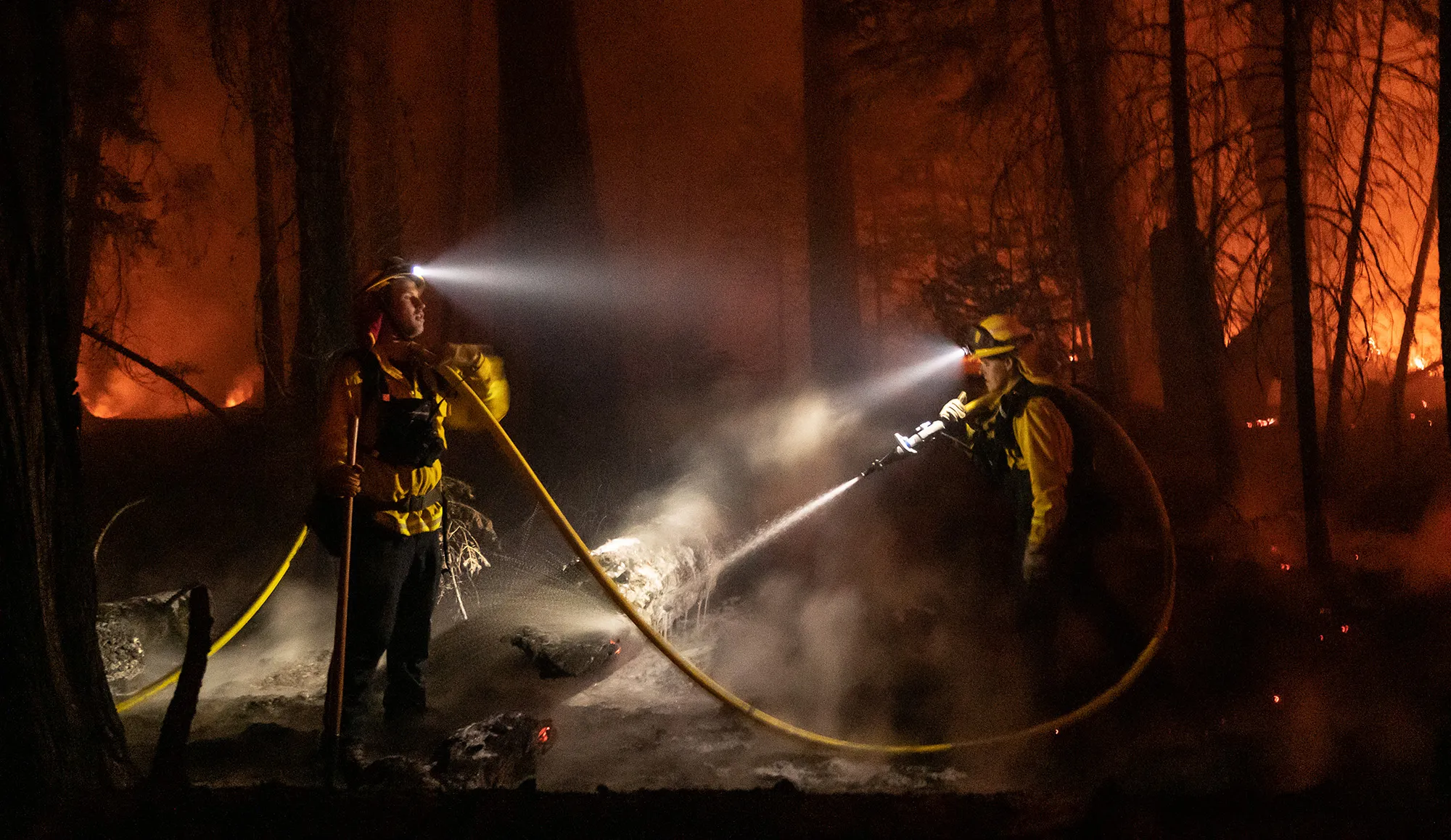 Firefighters battle flames during the Caldor Fire in Kyburz, California, on&nbsp;Aug. 21.