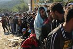Thousands of refugees wait to enter a reception center on the island of Lesbos on Oct. 14. More than 500,000 migrants have entered Europe so far this year. Of that number four-fifths of have paid to be smuggled by sea to Greece from Turkey, the main transit route into the EU.
