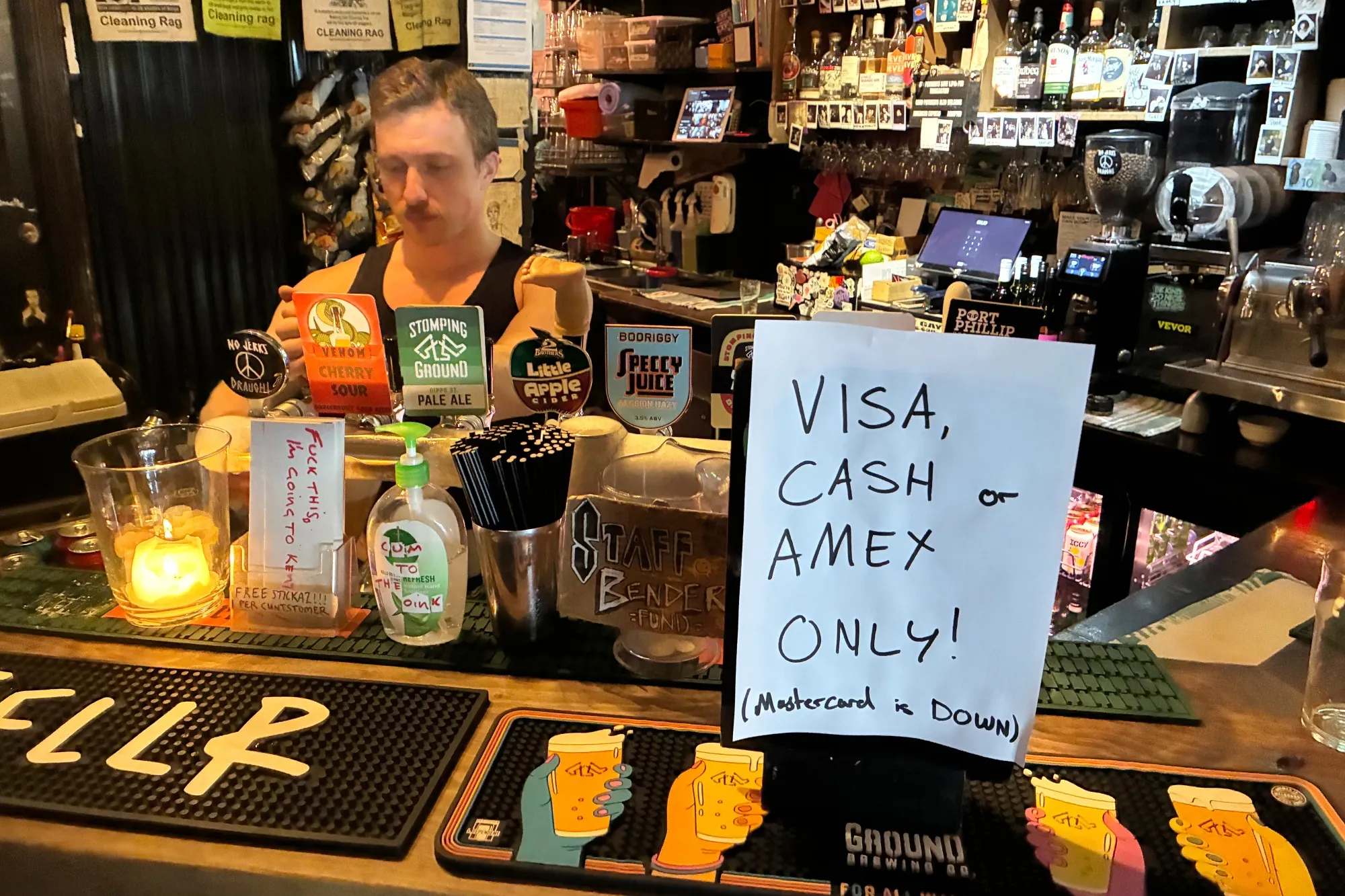 A sign declining Mastercard at a bar in Melbourne on Aug. 15.