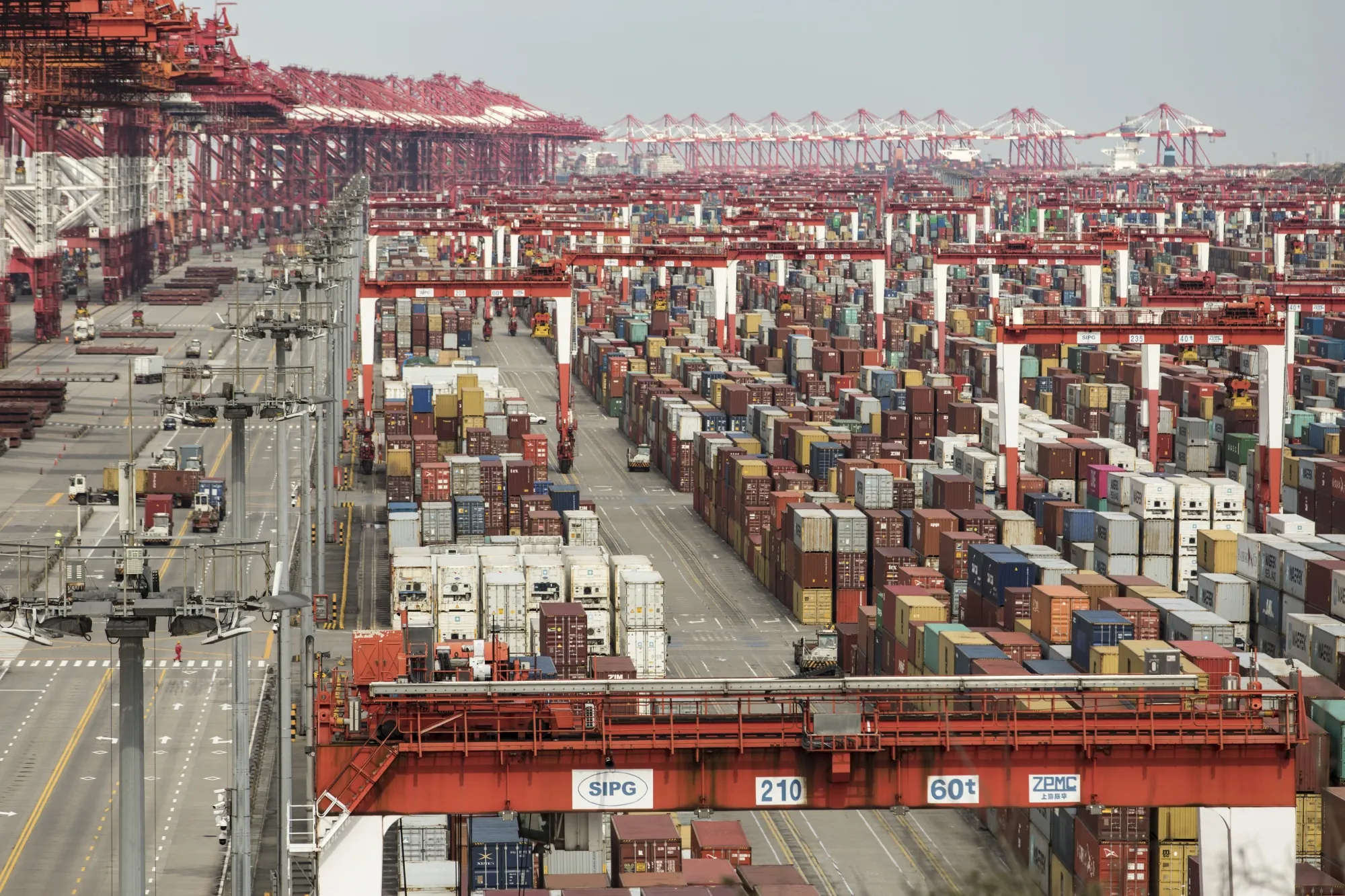 Shipping containers stacked at the Yangshan Deepwater Port in Shanghai, March 23.