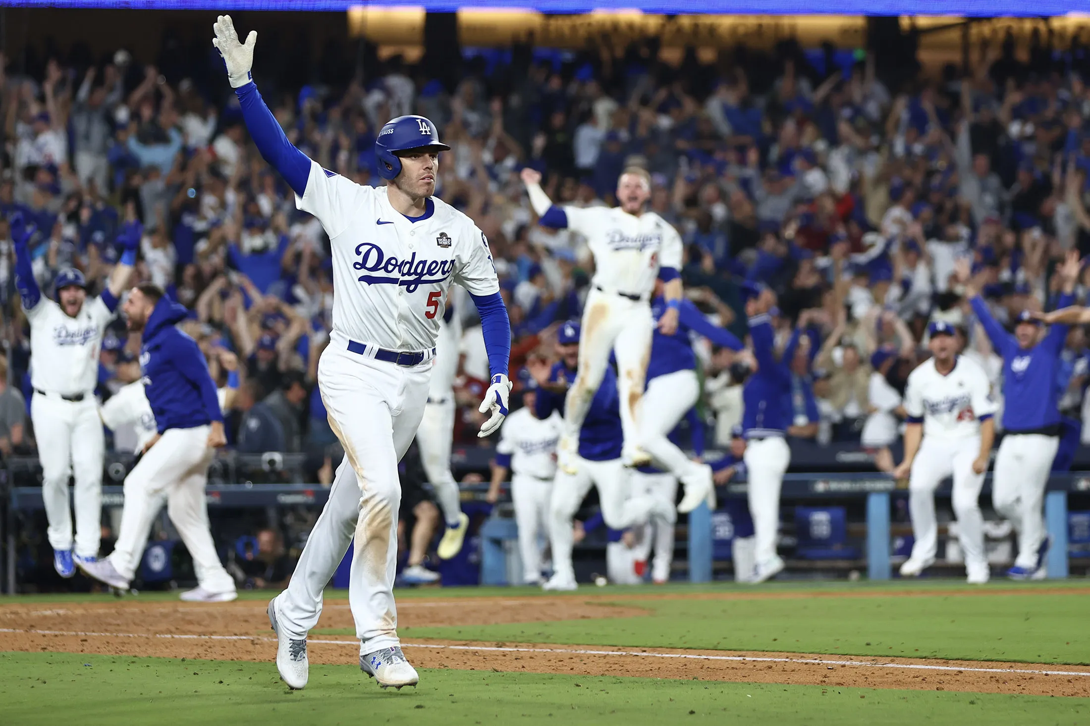 Freddie Freeman of the Los Angeles Dodgers celebrates after hitting a walk-off grand slam during the tenth inning against the New York Yankees during Game One of the 2024 World Series at Dodger Stadium in Los Angeles on Oct. 25.
