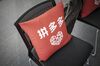 The Pinduoduo logo is seen on a cushion at the company's office in Shanghai, China, on Friday, Feb. 24, 2017. Pinduoduo, or PDD, is a kind of Facebook-Groupon mashup that Huang believes could revolutionize e-commerce.