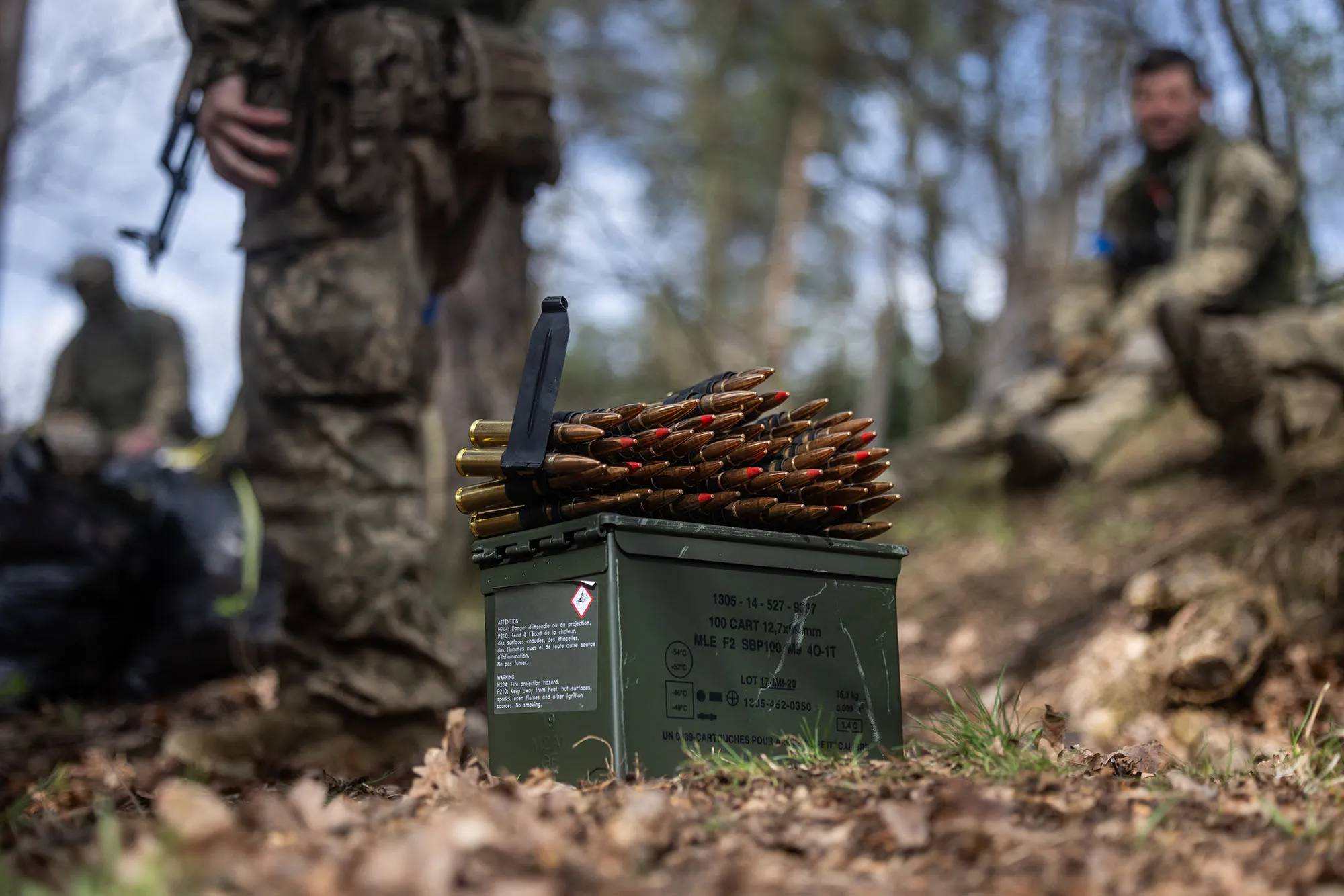 Machine gun munition is left to the side as Ukrainian soldiers prepare for a military training exercise.&nbsp;