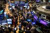 Traders work during the Slack Technologies Inc. initial public offering (IPO) on the floor of the New York Stock Exchange (NYSE) in New York, U.S., on Thursday, June 20, 2019. Following in the footsteps of music-streaming service Spotify Technology SA last year, the workplace messaging application is set to start trading on the New York Stock Exchange Thursday via a direct listing.