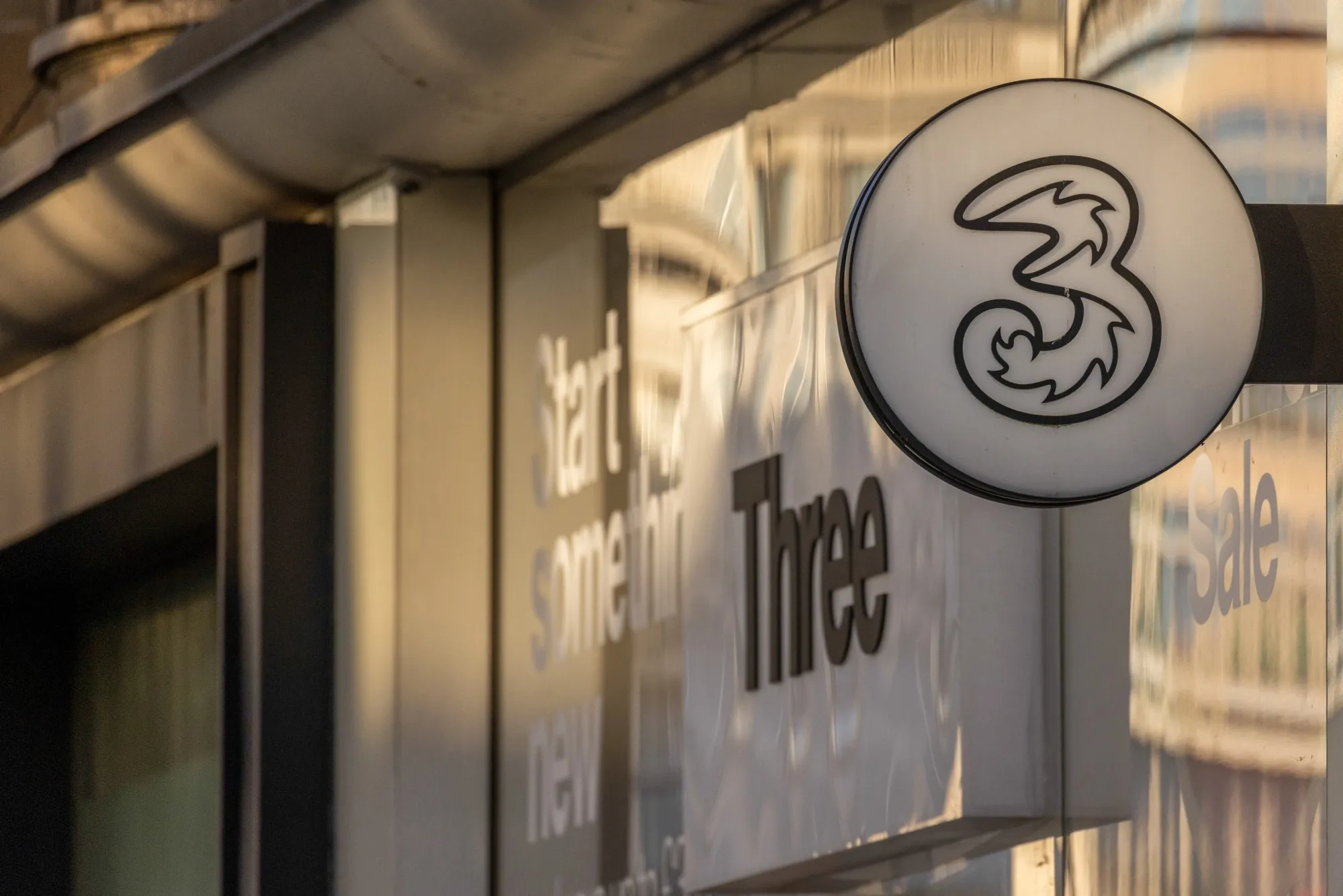 A sign outside a Three mobile phone store, operated by CK Hutchison Holdings Ltd., in London, UK.