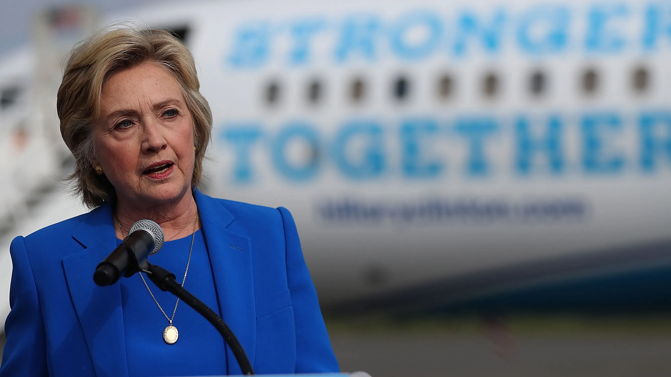 Democratic presidential nominee former Secretary of State Hillary Clinton speaks to reporters on the tarmac at Westchester County Airport on September 8, 2016 in White Plains, New York.
