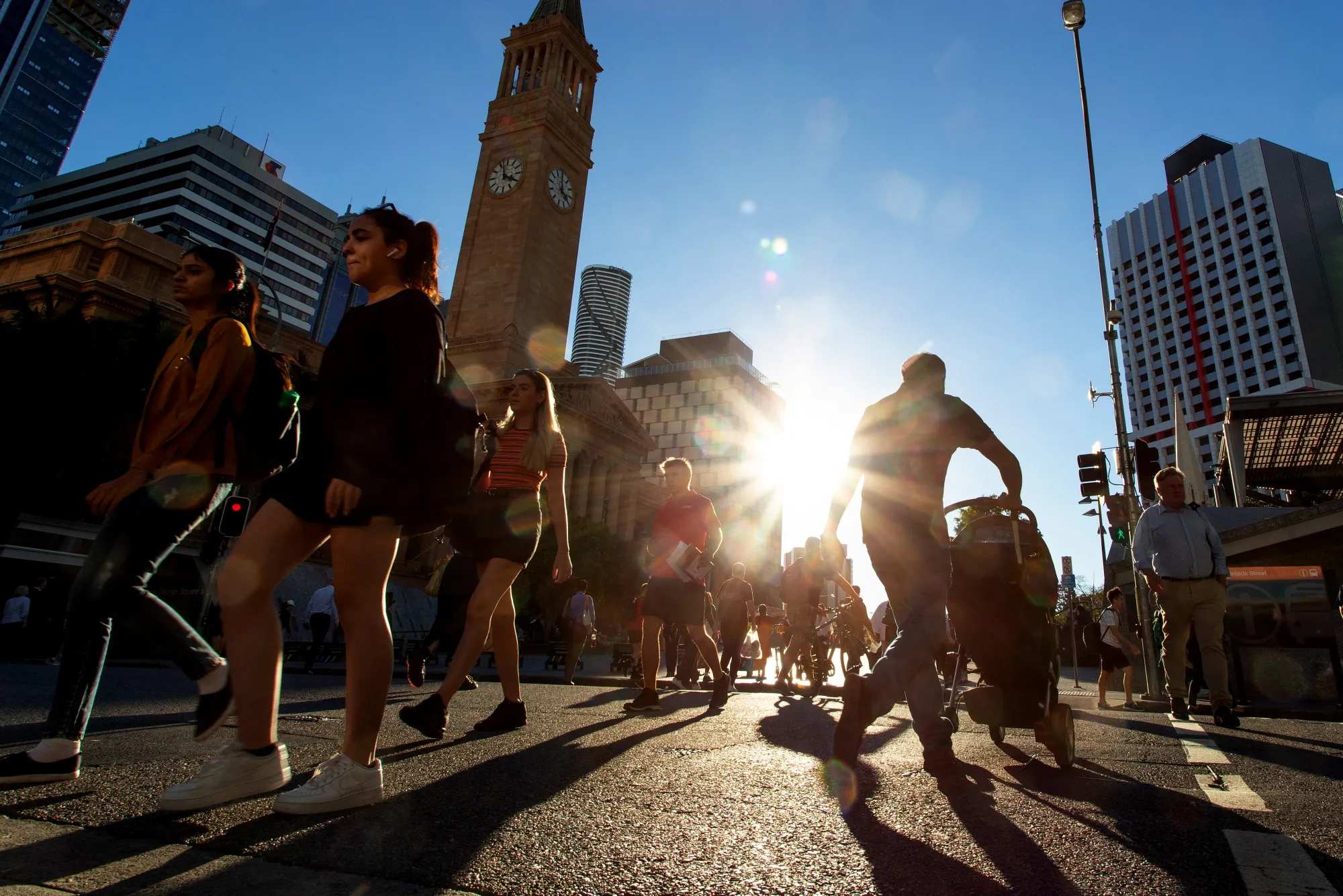 Pedestrians cross an intersection in Brisbane, Australia, on May 7, 2019.&nbsp;