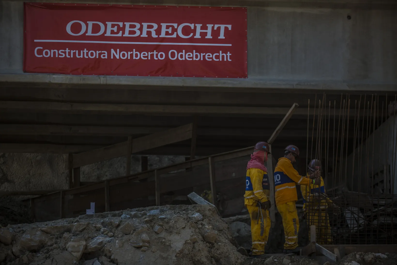 Odebrecht S.A. signage is displayed as contractors work on a construction site in the Barra da Tijuca neighborhood of Rio de Janeiro, Brazil.