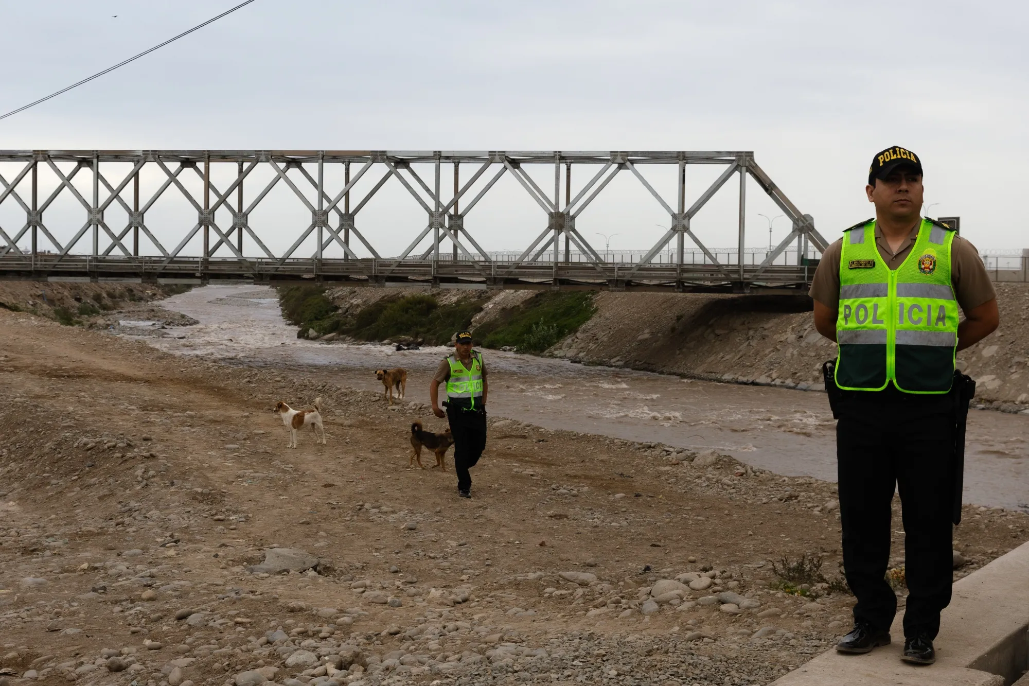 Police officers guard the provisional bridge connecting to the new Jorge Chavez Airport (LIM) during a press conference in Lima, Peru, on Wednesday, Dec. 18, 2024.